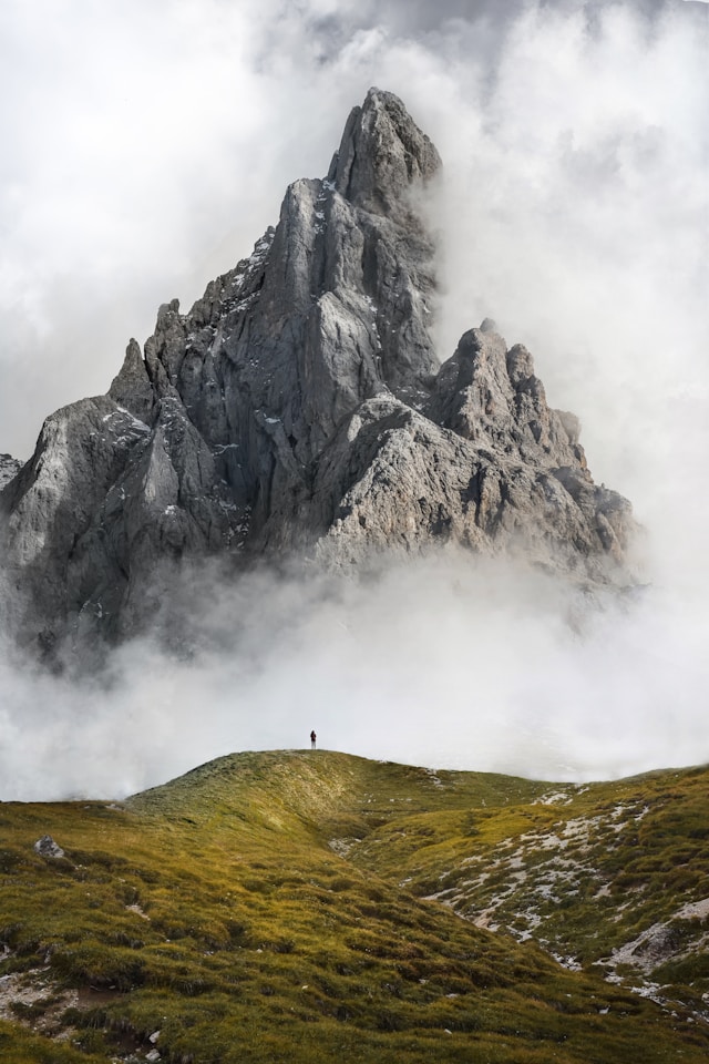 Misty Mountain with a person standing at its foot